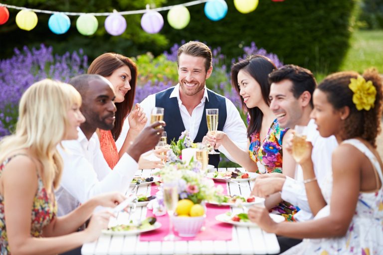 Group Of Friends Enjoying Outdoor Dinner Party